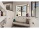 Well-lit walk-in shower with a stone seat, white subway tiles, and a window at 3201 N 91St St, Mesa, AZ 85207
