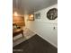 Basement area featuring brick wall, neutral flooring, and decorative nautical themed wall decor at 3330 E Main St # 332, Mesa, AZ 85213