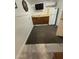 Basement area with kitchen appliances, dark cabinetry, and neutral colored flooring at 3330 E Main St # 332, Mesa, AZ 85213