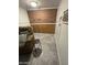 Basement nook featuring an accent chair with decorative pillows and faux brick wall at 3330 E Main St # 332, Mesa, AZ 85213