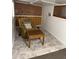 Cozy finished basement space with brick accent wall and comfortable seating area at 3330 E Main St # 332, Mesa, AZ 85213