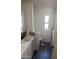 Bright bathroom with a modern vanity, sleek fixtures, and a window for natural light at 3330 E Main St # 332, Mesa, AZ 85213