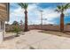 A backyard with palm trees and block fence at 3707 W Elm St, Phoenix, AZ 85019