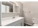 Bathroom featuring a vanity with white countertop and medicine cabinet at 3707 W Elm St, Phoenix, AZ 85019