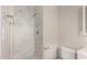 Bathroom featuring a shower with decorative tiles and a toilet at 3707 W Elm St, Phoenix, AZ 85019