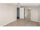 Bedroom features tiled floors and a closet with sliding doors at 3707 W Elm St, Phoenix, AZ 85019