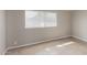Neutral bedroom with a window and tiled floors at 3707 W Elm St, Phoenix, AZ 85019