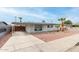 Charming single-story home featuring desert landscaping, a covered parking area, and neutral paint at 3707 W Elm St, Phoenix, AZ 85019