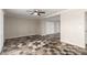 Spacious living room featuring decorative tile flooring, a ceiling fan, and ample natural light at 3707 W Elm St, Phoenix, AZ 85019
