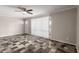 Inviting living room featuring decorative tile flooring, a ceiling fan, and ample natural light at 3707 W Elm St, Phoenix, AZ 85019