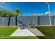 Relaxing backyard with artificial grass and seating area at 4129 W Caron St, Phoenix, AZ 85051