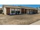 Exterior shot of a single-story home with a newly landscaped front yard and desert style facade at 4129 W Caron St, Phoenix, AZ 85051