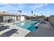 Gorgeous pool with a baja step, lounge chairs, and refreshing water at 4129 W Caron St, Phoenix, AZ 85051