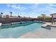This backyard features a sparkling pool, complete with tanning ledges and a soothing waterfall feature at 4129 W Caron St, Phoenix, AZ 85051
