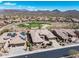 An aerial view of desert community with lush golf course and mountain views for peaceful living at 41819 N Anthem Ridge Dr, Phoenix, AZ 85086