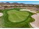 Expansive aerial view of a well-manicured golf course, showcasing the green, sand traps, and surrounding landscape at 41819 N Anthem Ridge Dr, Phoenix, AZ 85086