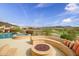 Backyard with a firepit, pool, and scenic views at 41819 N Anthem Ridge Dr, Phoenix, AZ 85086