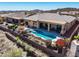 Aerial view of backyard with pool, spa, seating area and desert landscape to enjoy outdoor living at 41819 N Anthem Ridge Dr, Phoenix, AZ 85086