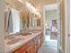 Bathroom offers double vanity, light-toned walls, and tile flooring and a view of the bedroom at 41819 N Anthem Ridge Dr, Phoenix, AZ 85086
