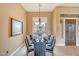 Elegant dining room featuring a table set for eight, chandelier, and neutral walls at 41819 N Anthem Ridge Dr, Phoenix, AZ 85086