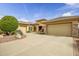 Stylish one-story home showcasing a circle driveway, desert landscaping, and a two-car garage at 41819 N Anthem Ridge Dr, Phoenix, AZ 85086