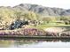Scenic golf course with waterfall, lake and colorful flowerbed providing an idyllic setting at 41819 N Anthem Ridge Dr, Phoenix, AZ 85086
