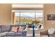 Living room featuring comfortable seating, a view of the outdoor pool, and elegant decor at 41819 N Anthem Ridge Dr, Phoenix, AZ 85086