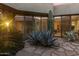 An outdoor courtyard showcases a variety of desert plants and modern architecture at 41823 N 111Th Pl, Scottsdale, AZ 85262