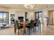 Elegant dining room featuring modern lighting, stylish furniture, and views of the living room at 41823 N 111Th Pl, Scottsdale, AZ 85262