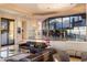 Bright, elegant living room with contemporary furniture, glass railing, and stylish decor at 41823 N 111Th Pl, Scottsdale, AZ 85262
