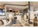 Open-concept living room with a glass wall, modern decor, and abundant natural light at 41823 N 111Th Pl, Scottsdale, AZ 85262