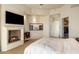 Comfortable main bedroom with fireplace, and walk-in closet at 41823 N 111Th Pl, Scottsdale, AZ 85262