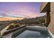 Inviting pool area featuring stunning desert views and beautiful sunset scenery at 41823 N 111Th Pl, Scottsdale, AZ 85262