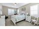 Comfortable bedroom with ample natural light, carpet flooring, and a ceiling fan at 42920 W Kingfisher Dr, Maricopa, AZ 85138