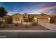 Charming single-story home boasting a two-car garage and low maintenance front yard at 42920 W Kingfisher Dr, Maricopa, AZ 85138