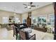 Spacious living room with plush seating arrangements and ample natural light throughout at 42920 W Kingfisher Dr, Maricopa, AZ 85138