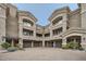 Exterior shot of townhome featuring multiple units, each with private garages and balconies for comfortable living at 4465 E Paradise Village S Pkwy # 1133, Phoenix, AZ 85032