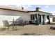 Spacious backyard featuring a covered patio with stylish outdoor seating, ideal for relaxing and entertaining guests at 4617 E La Puente Ave, Phoenix, AZ 85044