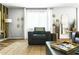 A comfy living room with area rug, throw pillows, and large window at 4617 E La Puente Ave, Phoenix, AZ 85044