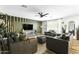 Bright living room with wood floors, an accent wall, and ample seating at 4617 E La Puente Ave, Phoenix, AZ 85044