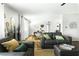 Open-concept layout showcases the living area with stylish decor and natural light at 4617 E La Puente Ave, Phoenix, AZ 85044