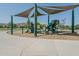 Fun playground area with slides and shade structures, perfect for to play and enjoy the outdoors at 4617 E La Puente Ave, Phoenix, AZ 85044