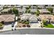 Aerial perspective of a home with desert-style landscaping and a three-car garage at 4665 E Dartmouth St, Mesa, AZ 85205