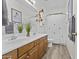Bathroom with a double sink vanity, framed mirror, and decorative accents at 4665 E Dartmouth St, Mesa, AZ 85205