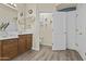 Bathroom with wood cabinets, double sinks, large mirror and toilet room at 4665 E Dartmouth St, Mesa, AZ 85205