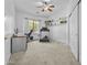 Bright bedroom featuring a ceiling fan, built-in shelves, and a treadmill for exercise at 4665 E Dartmouth St, Mesa, AZ 85205
