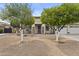 Well-maintained front yard with desert landscaping and trees at 4665 E Dartmouth St, Mesa, AZ 85205