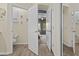 Hallway with multiple doors open, allowing view of bathroom and bedroom at 4665 E Dartmouth St, Mesa, AZ 85205