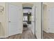 Hallway with multiple doors open, allowing view of bathroom and bedroom at 4665 E Dartmouth St, Mesa, AZ 85205