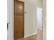 Hallway with a large storage cabinet and views into another room at 4665 E Dartmouth St, Mesa, AZ 85205